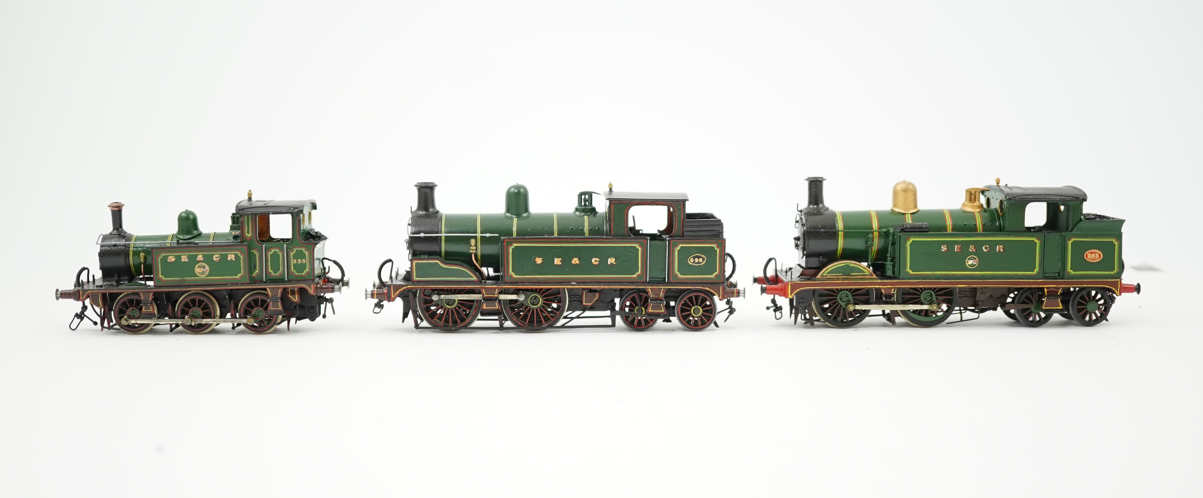 Three 00 gauge brass and white metal kit built Wainwright designed SE&CR tank locomotives (possibly by Wills Finecast); a class R1 0-4-4T, 696, a class H 0-4-4T, 263, and a class P 0-6-0T, 325, constructed, all painted a